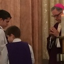 OC students serve with Bishop Jarrell