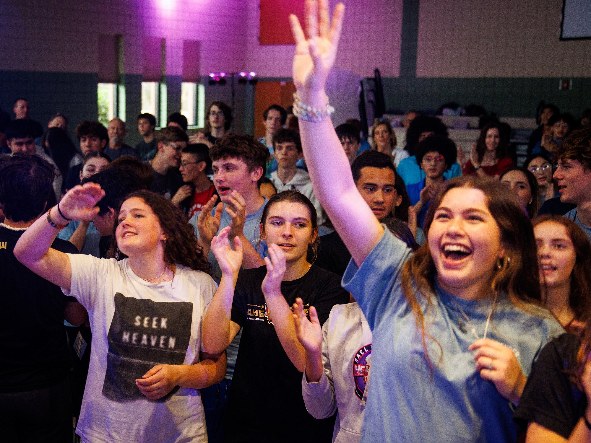 teens singing and worshipping