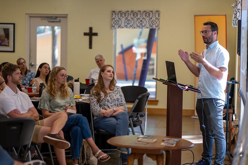 parishioners listen to presentation