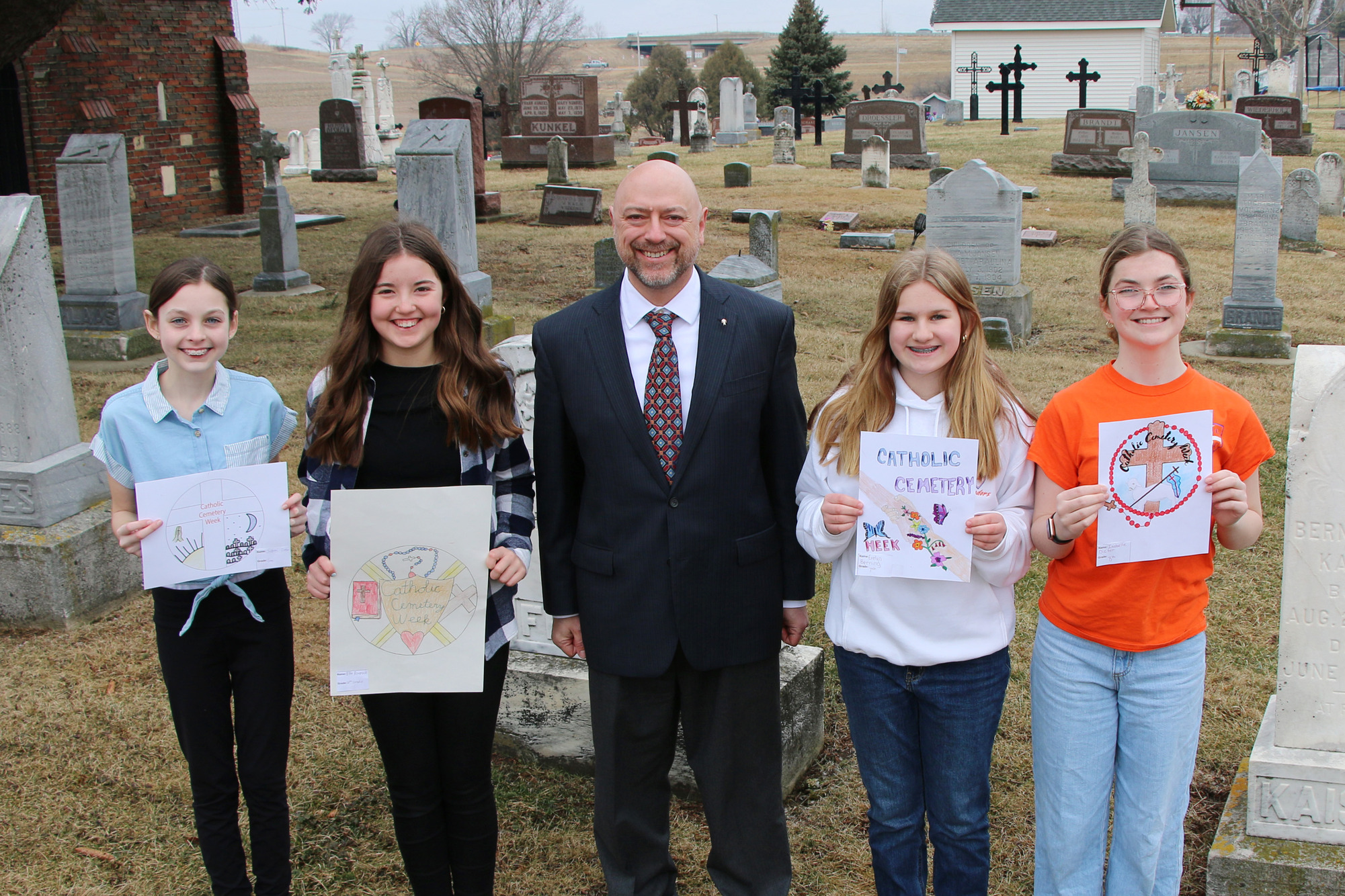 Director of Cemeteries Damian Lenshek with 4 finalists