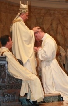 Laying on of Hands at priestly ordination.