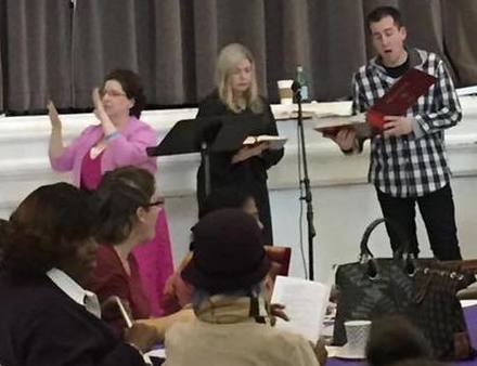 ASL interpreter and two singers at Lesson and Carols event 2016
