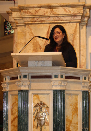 Lector proclaiming the Word of God.