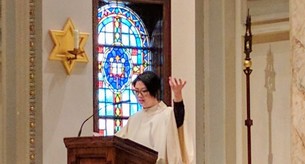 Cantor singing at Mass.