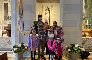 St. Ann's Academy Couple Visits St. Ann to Show 5 Kids Where They Met