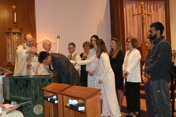 People of various religious backgrounds find  a home in the Catholic Church this Easter