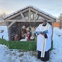 Father Joseph Blesses Christmas Creche