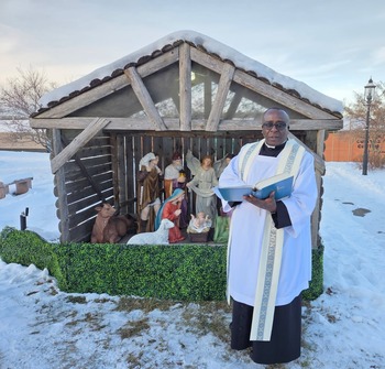 Father Joseph Blesses Christmas Creche