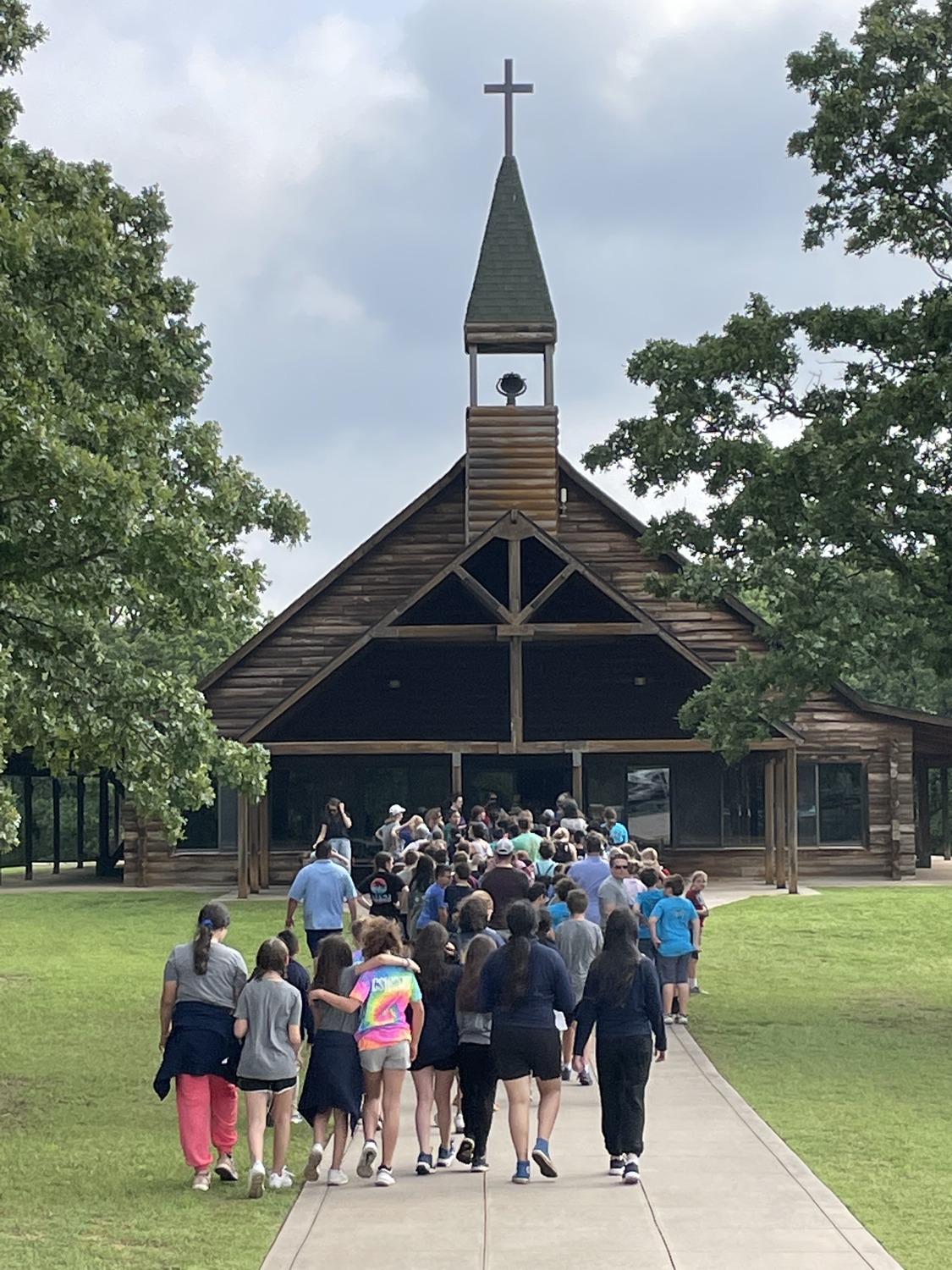students walking toward a chapel