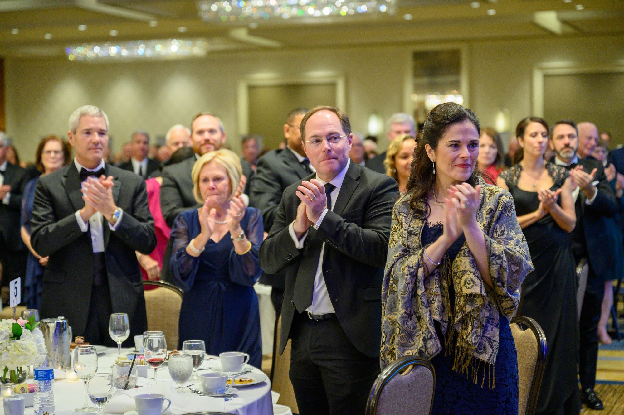 Attendees stand to applaud St. John Paul II Award recipient