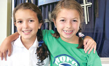 Mary Queen of Peace student-sisters make ‘Hair Ties for Haiti’