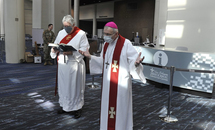 Archbishop Aymond blesses the medical facilities at the convention center