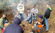 Catholic fathers and sons bond, experience God in outdoors