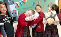 St. Clement of Rome third graders cover The Good Shepherd School in love