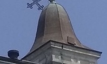 St. Augustine Church cross holds fast to its cupola