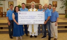 St. Francis Xavier Men's Club generously donates money to the elementary school