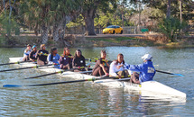 Xavier female rowers stroke forward into history