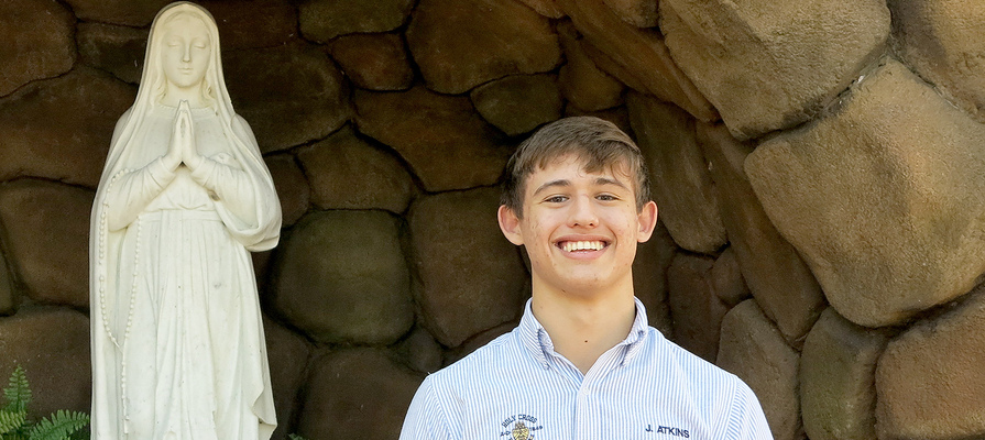 Drawn to the faith, Holy Cross junior becomes Catholic