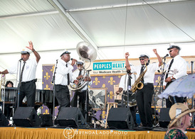 Second line music lifts hearts, leads bridal party to reception