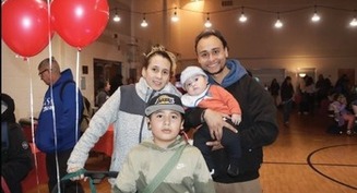 Young families celebrate first Christmas in US with hope, despite their needs
