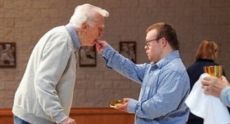 With reverence, contagious smile, volunteer with Down syndrome inspires Michigan parish