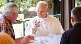 Burn with 'fire' of God's love, pope says at Mass and lunch with the poor