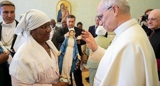 Pope defends rights of refugees evicted to build US military base