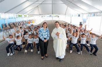 Priest, principal share award for rebuilding church and school after earthquake