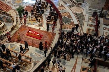 Converging lines: Thousands wait hours to pay respects to Pope Francis