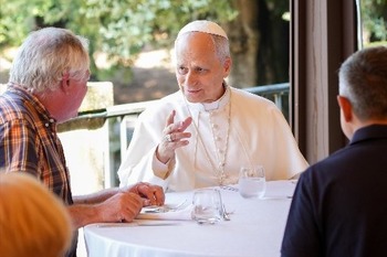 Burn with 'fire' of God's love, pope says at Mass and lunch with the poor