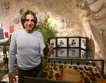 Inviting pilgrims back is more than business, it's family history, Holy Land shop owners say