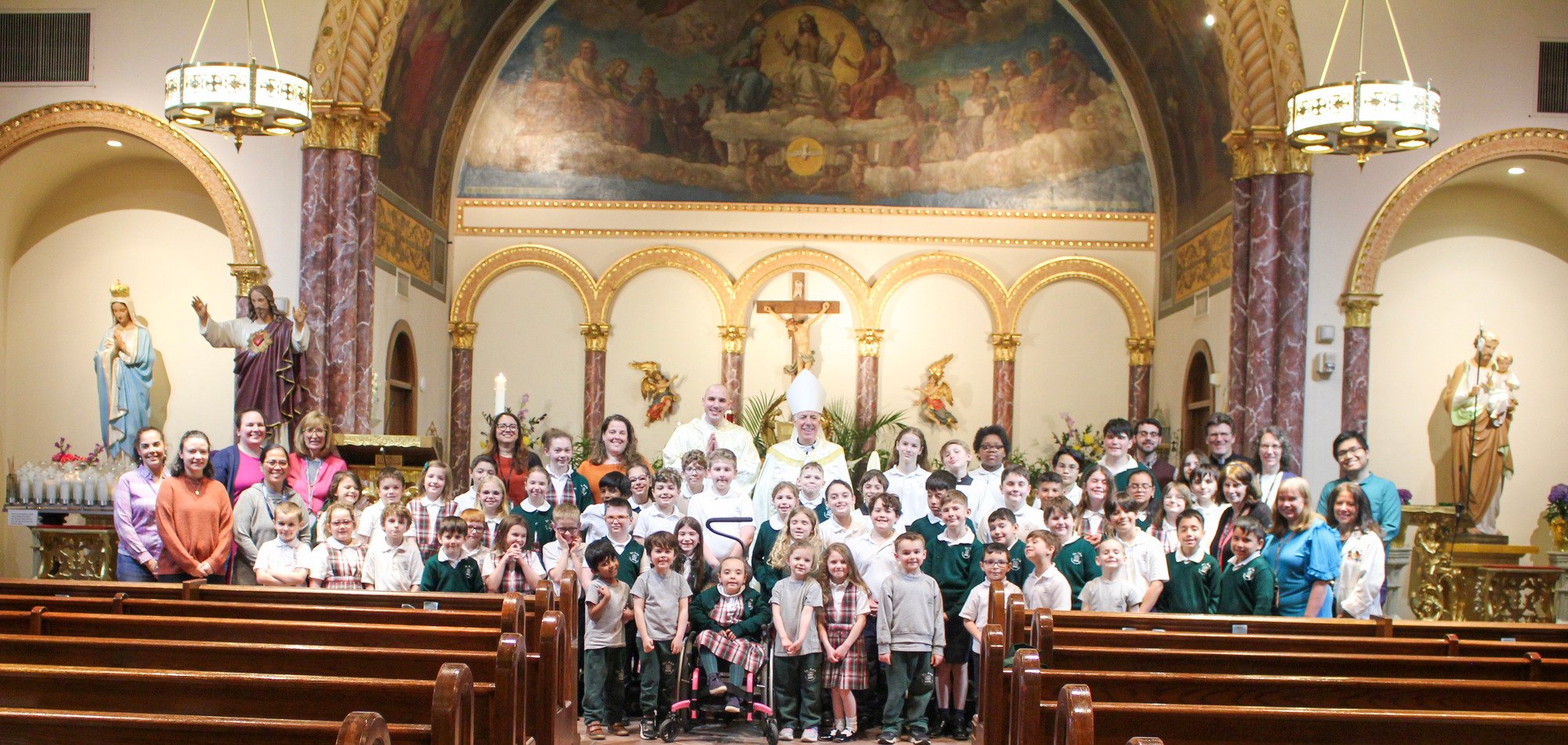 Photo of the faculty, staff and students with Bishop Checchio during his pastoral visit to St. Ann Classical Academy