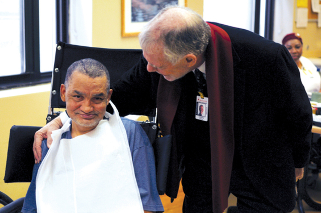 Dr. Anthony Lechich, medical director of the Huntington’s disease program at TCC, with a patient.