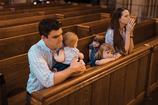 A family prays at the Church of St. Vincent Ferrer in Manhattan.