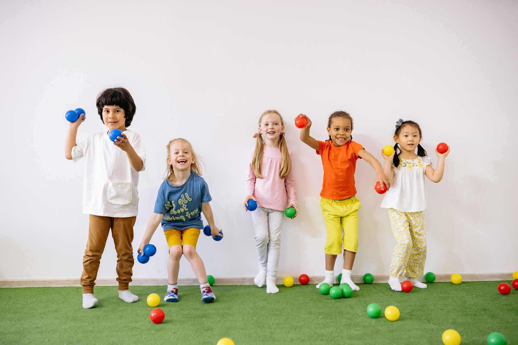Photo by Yan Krukau: https://www.pexels.com/photo/little-girls-and-boys-having-fun-playing-with-colorful-balls-8613146/