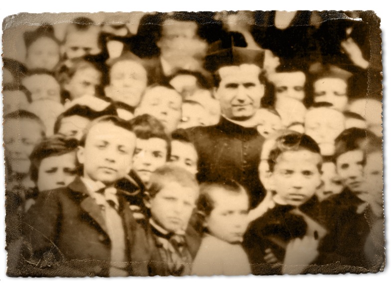 Photograph of Don Bosco with young children