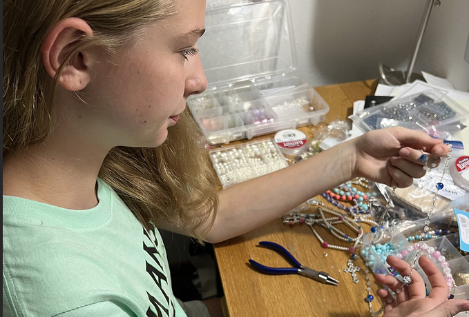 Young parishioner takes up craft of rosary making and repair