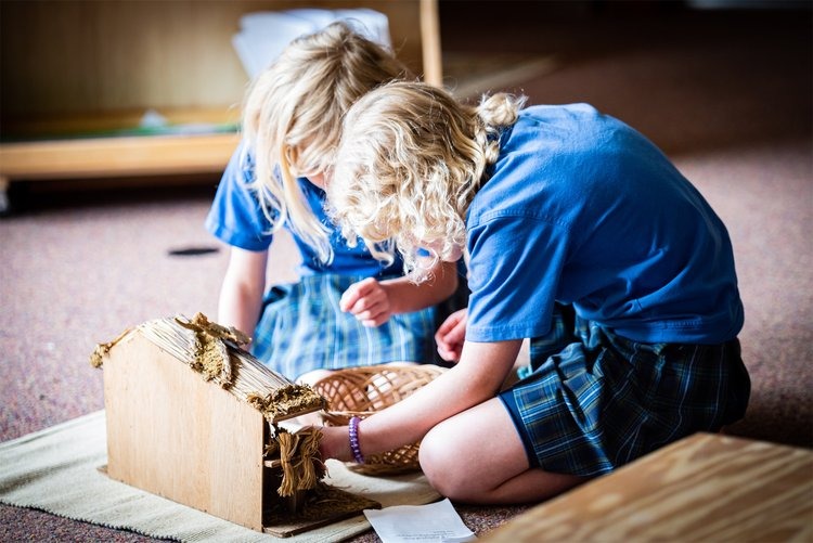 two students working on a religion project