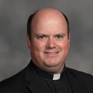 Rev. John P. Blewett, SJS