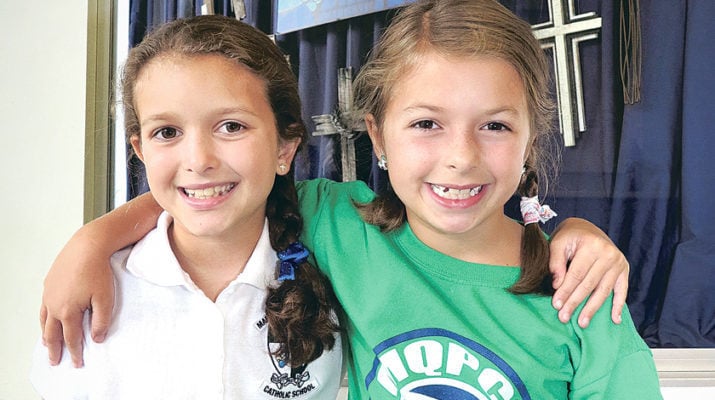 Mary Queen of Peace student-sisters make ‘Hair Ties for Haiti’