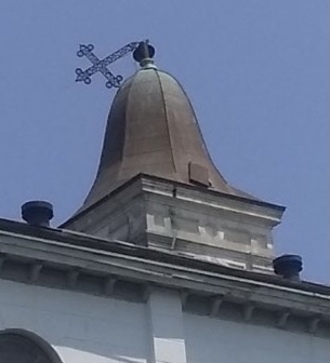 St. Augustine Church cross holds fast to its cupola