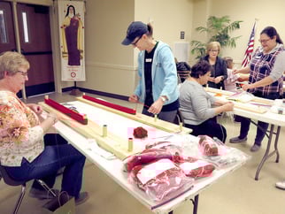 Tight-knit parish trims yarn to create wigs for sick kids