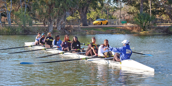 Xavier female rowers stroke forward into history