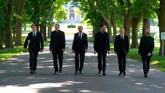 Father Ricci blessing cross in class