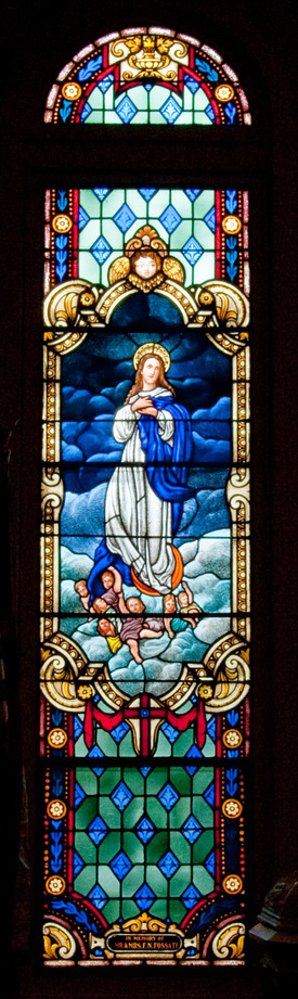 stained glass window depicting Our Lady